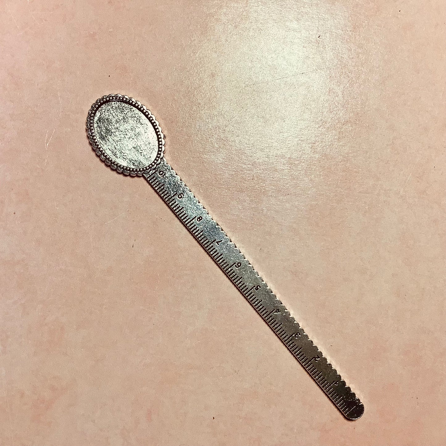 Metal bookmark with cabochon inset and ruler
