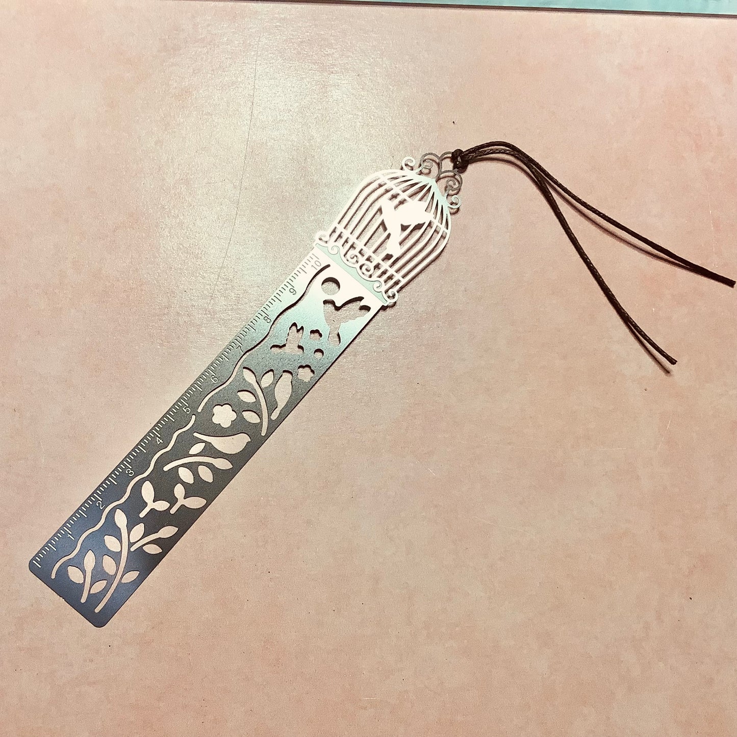 Birdcage ruler, embossed metal bookmark