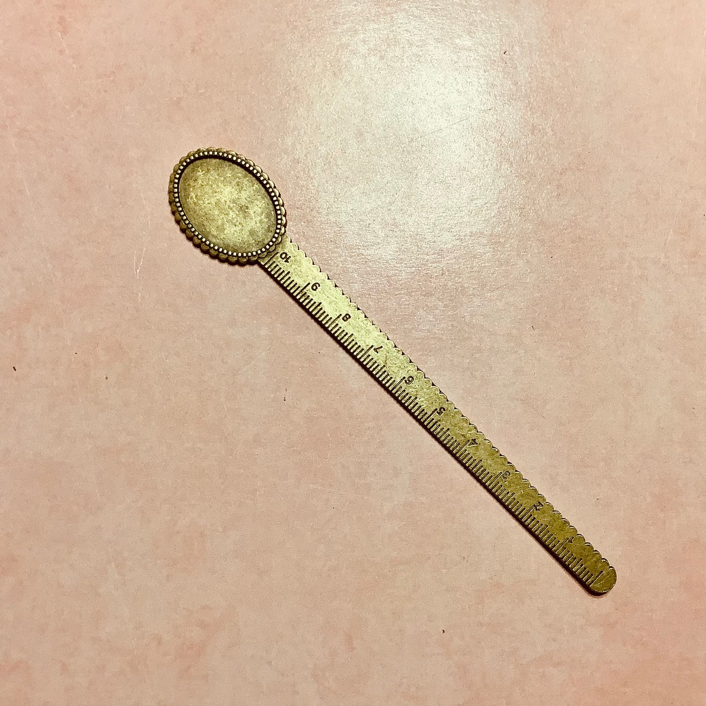 Metal bookmark with cabochon inset and ruler