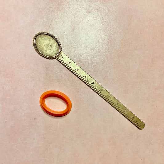 Metal bookmark with cabochon inset and ruler