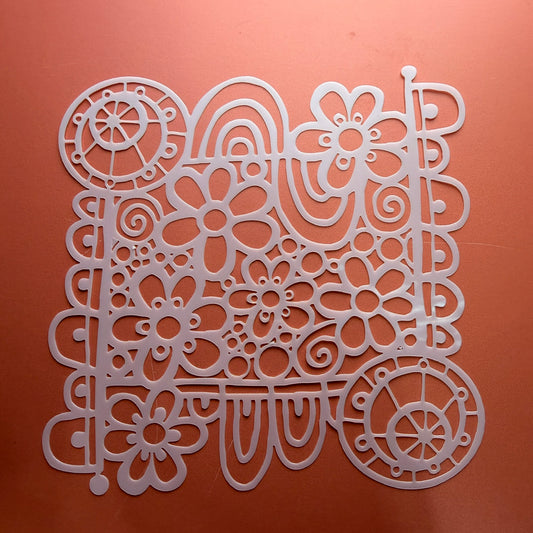 Wildflower Wheel Mylar stencil 6 inch showing daisy swirl and wheel motif design cut from durable mylar
