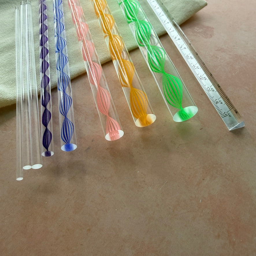 Dotting and Pressing Set acrylic rods fanned out showing graduating sizes with purple blue pink orange and green spiral patterns
