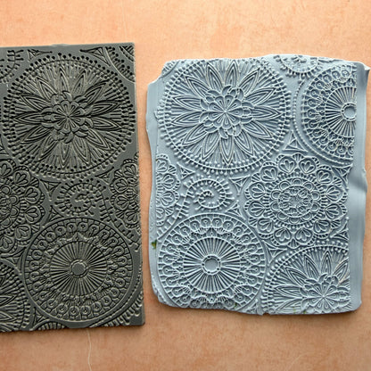 Blooming with Joy 3x4 inch rubber stamp beside impressed polymer clay slab showing full mandala floral pattern