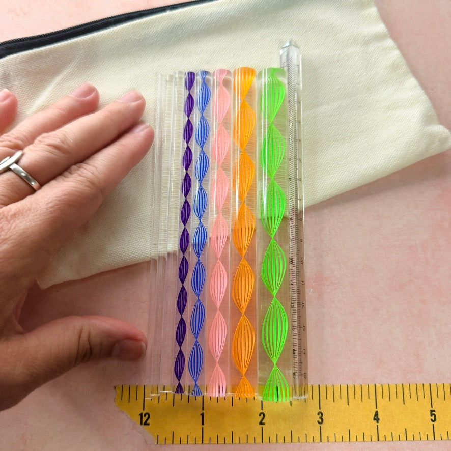 Dotting and Pressing Set 9 piece acrylic rod set beside ruler showing full length of rods with zip canvas pouch